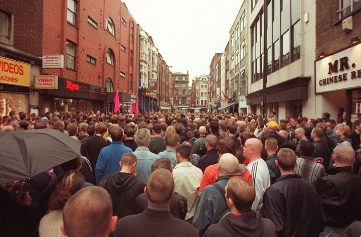 Friends and relatives of the victims of the Soho bomb blast attend a Vigil of Remembrance, at the scene outside the Admiral Duncan pub.