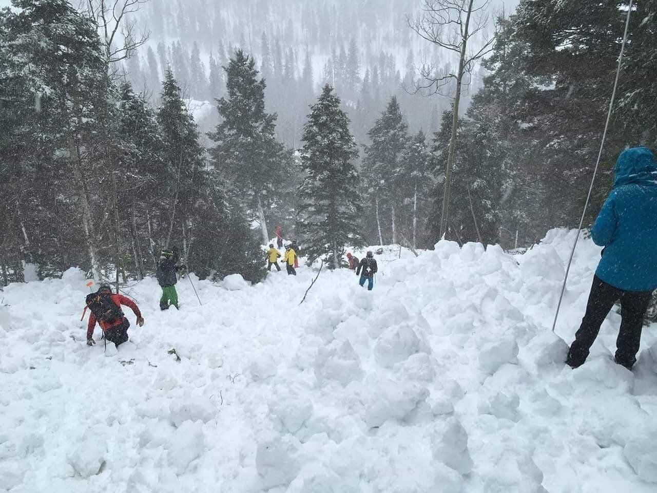 Rescue workers looking for bodies after an avalanche in the Taos Ski Valley in New Mexico on March 13, 2019.