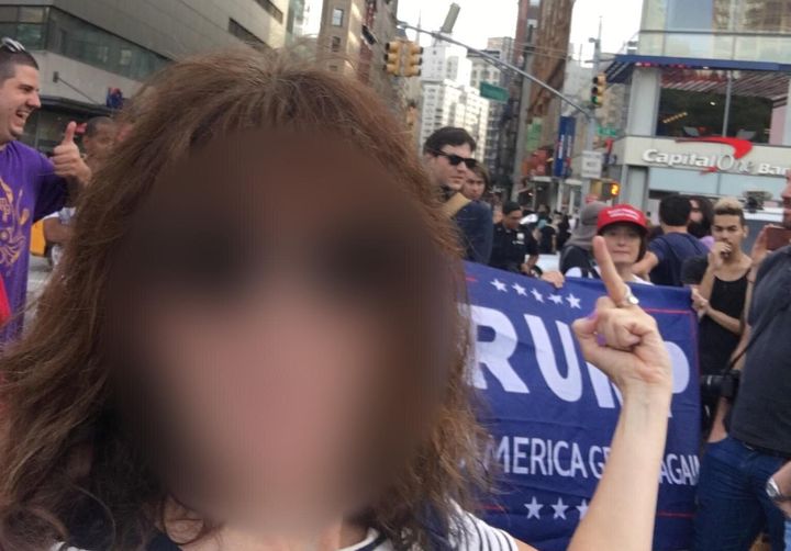 A woman shows her feelings toward the Trump supporters that showed up to an event organized by the Resisters, later revealed to be a Russian-backed Facebook group.