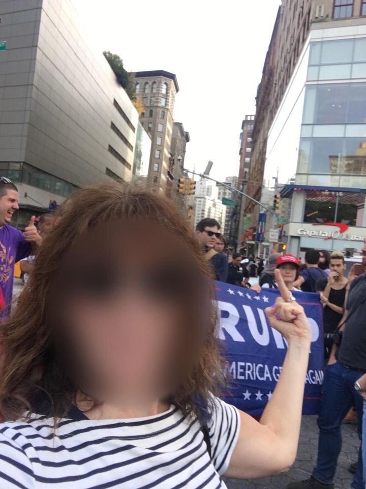 A woman shows her feelings toward the Trump supporters that showed up to an event organized by the Resisters, later revealed to be a Russian-backed Facebook group.