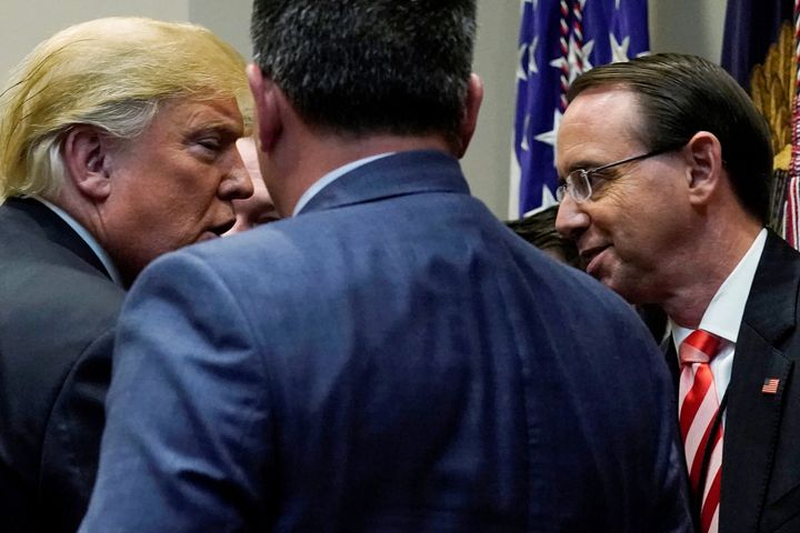 President Donald Trump greets Deputy U.S. Attorney General Rod Rosenstein at a bill signing ceremony at the White House on Oct. 10, 2018.