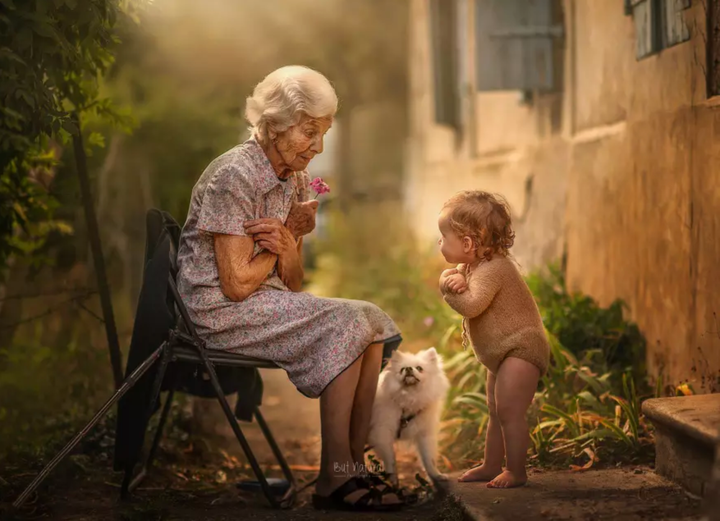 Just like grandma! A grandbaby mirrors her nana's posture.