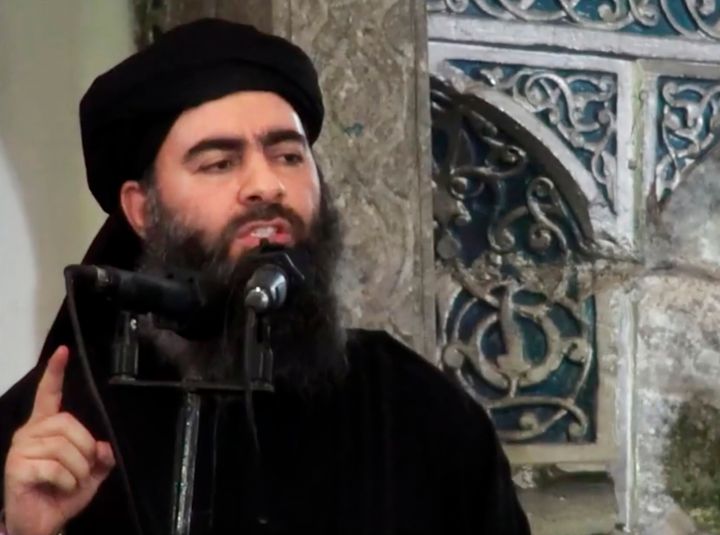 This image made from video posted on a militant website July 5, 2014, purports to show the leader of the Islamic State group, Abu Bakr al-Baghdadi, delivering a sermon at a mosque in Iraq during his first public appearance. 