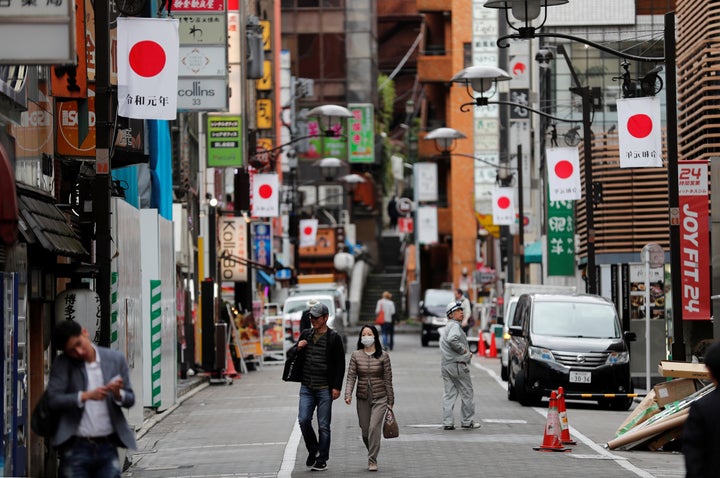 Flags celebrating Reiwa, Japan's new imperial era, are displayed in Tokyo on April 30, 2019.