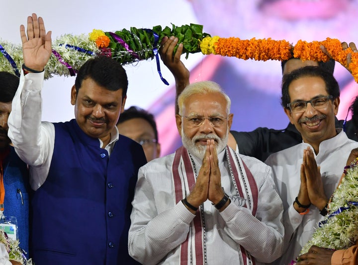 Prime Minister Modi, Shiv Sena president Uddhav Thackeray and Maharashtra CM Devendra Fadnavis during a rally in Maharashtra