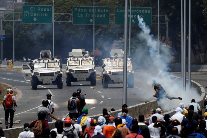 Demonstrators face off against armored vehicles during protests on Tuesday.