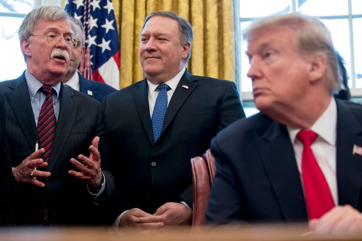 National security adviser John Bolton, Secretary of State Mike Pompeo and President Donald Trump.