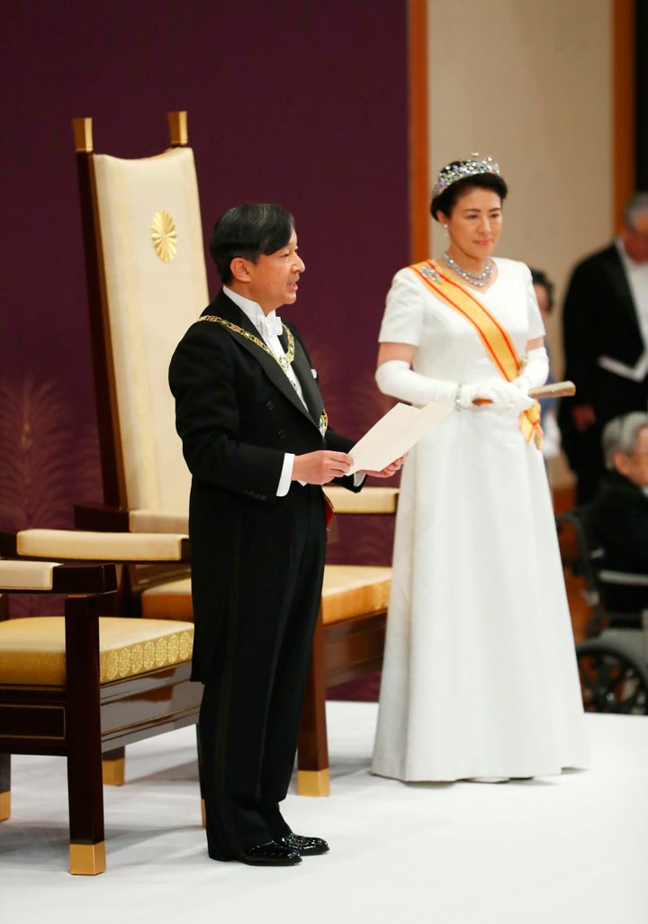 Japan's new Emperor Naruhito, accompanied by new Empress Masako, makes his first address during a ritual after succeeding his father Akihito at Imperial Palace in Tokyo, Wednesday, May 1, 2019. 