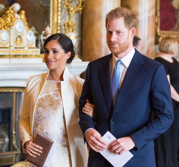 Meghan, Duchess of Sussex, and Prince Harry attend a reception to mark the 50th anniversary of the investiture of the Prince of Wales at Buckingham Palace on March 5 in London.