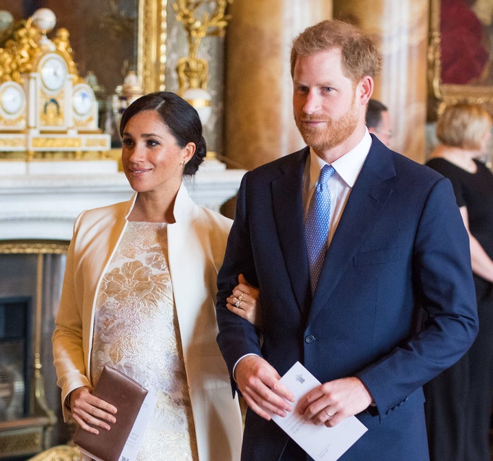 Meghan, Duchess of Sussex, and Prince Harry attend a reception to mark the 50th anniversary of the investiture of the Prince