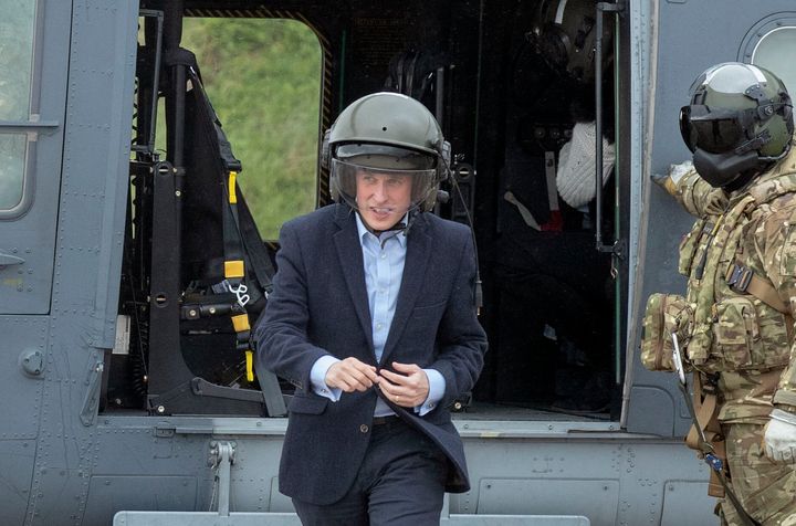 Williamson seen wearing an oversized helmet on a visit to a training area in Wiltshire.