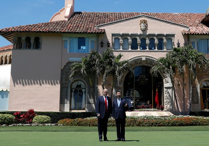 President Donald Trump and Chinese President Xi Jinping pause for photographers as they walk together at Mar-a-Lago on April 7, 2017, in West Palm Beach, Florida.
