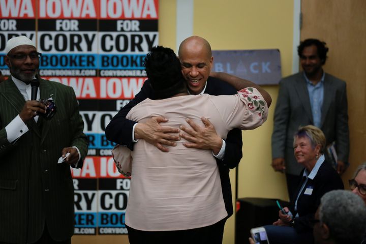 Sen. Cory Booker (D-N.J.) gives out a hug at an Iowa town hall in Des Moines last month.