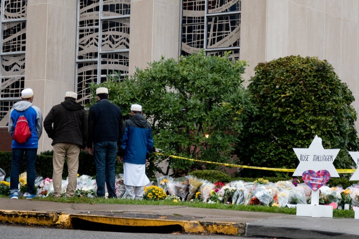 Muslim mourners stop in front of a makeshift memorial on Oct. 28, 2018, at the site of a mass shooting at the Tree of Life synagogue in Pittsburgh.