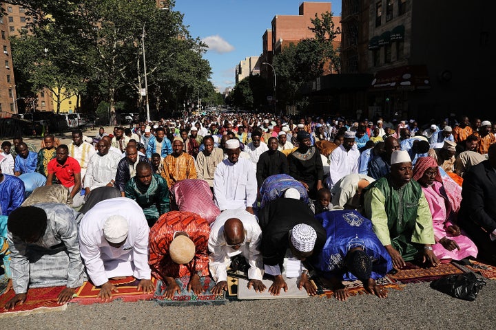 Muslims participate in an outdoor prayer event at Masjid Aqsa-Salam mosque, Manhattan's oldest West African mosque, to mark the end of Ramadan on June 15, 2018, in New York City.