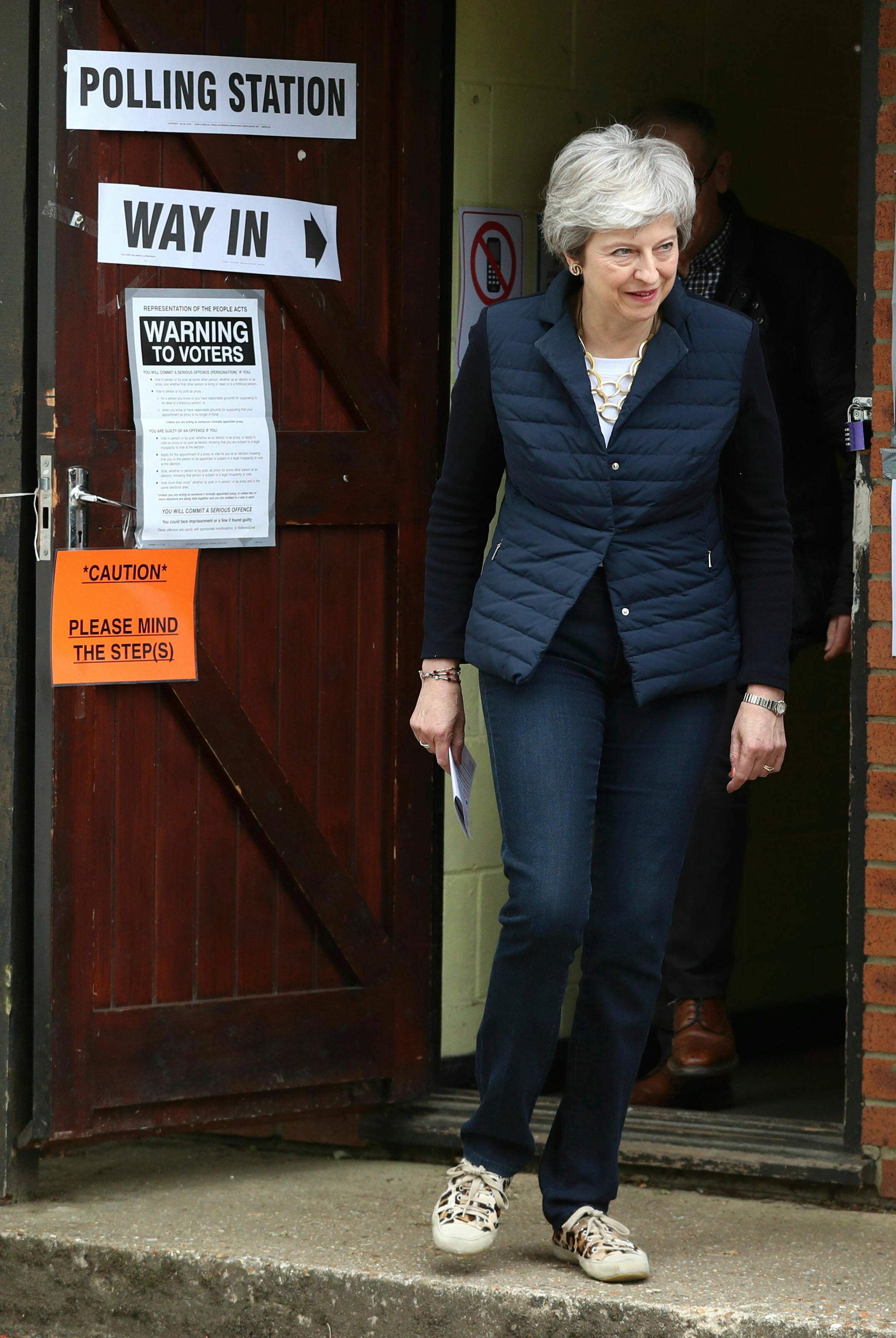 Britain's Prime Minister Theresa May leaves after casting her vote at a polling station near her home in Thames Valley, England, Thursday, May 2, 2019. as voters headed to the polls for council and mayoral elections across England and Northern Ireland. (Andrew Matthews/PA via AP)