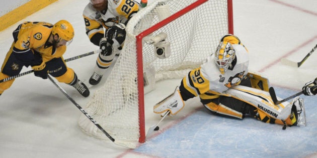 Jun 5, 2017; Nashville, TN, USA; Nashville Predators center Frederick Gaudreau (32) scores a goal past Pittsburgh Penguins goalie Matt Murray (30) during the second period in game four of the 2017 Stanley Cup Final at Bridgestone Arena. Mandatory Credit: Scott Rovak-USA TODAY Sports