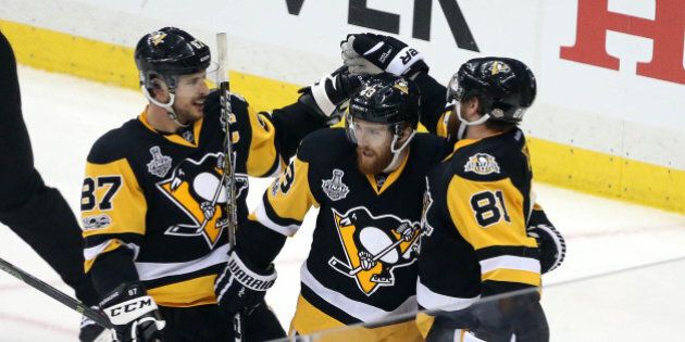 Jun 8, 2017; Pittsburgh, PA, USA; Pittsburgh Penguins right wing Phil Kessel (81) celebrates with center Sidney Crosby (87) and center Scott Wilson (23) his goal scored against the Nashville Predators during the second period in game five of the 2017 Stanley Cup Final at PPG PAINTS Arena. Mandatory Credit: Charles LeClaire-USA TODAY Sports