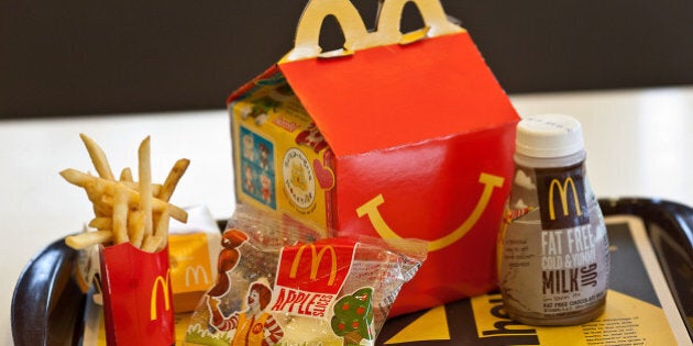 A Happy Meal is displayed for a photograph on a tray at a McDonald's Corp. restaurant in Little Falls, New Jersey, U.S., on Wednesday, Feb. 15, 2012. McDonald's Corp., the world's largest restaurant chain, said sales at stores open at least 13 months rose 6.7 percent globally last month as beverages and Chicken McBites helped the U.S. business. Photographer: Emile Wamsteker/Bloomberg via Getty Images