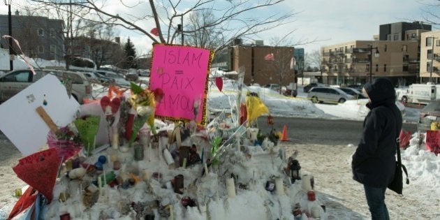 People place messages and flowers near a mosque that was the location of a shooting spree in Quebec City, Quebec on January 31, 2017.Alexandre Bissonnette cut a low profile as a shy, withdrawn political science student, keen on far-right ideas. The Canadian political science student known to have nationalist sympathies was charged January 30, 2017 with six counts of murder over a shooting spree at a Quebec mosque -- one of the worst attacks ever to target Muslims in a western country.Prime Minister Justin Trudeau condemned as a 'terrorist attack' Sunday night's assault on the Islamic Cultural Center in a busy district of Quebec City, which sent terrified worshippers fleeing barefoot in the snow. / AFP / Alice Chiche (Photo credit should read ALICE CHICHE/AFP/Getty Images)