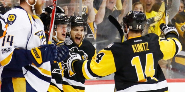 PITTSBURGH, PA - MAY 31: Jake Guentzel #59 of the Pittsburgh Penguins celebrates with Conor Sheary #43 and Chris Kunitz #14 after scoring a goal during the first period in Game Two of the 2017 NHL Stanley Cup Final against the Nashville Predators at PPG Paints Arena on May 31, 2017 in Pittsburgh, Pennsylvania. (Photo by Gregory Shamus/Getty Images)