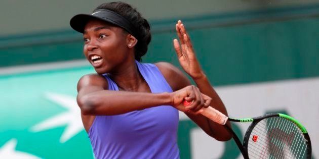 Canada's Francoise Abanda returns the ball to France's Tessah Andrianjafitrimo returns the ball to during their tennis match at the Roland Garros 2017 French Open on May 29, 2017 in Paris. / AFP PHOTO / Thomas SAMSON (Photo credit should read THOMAS SAMSON/AFP/Getty Images)