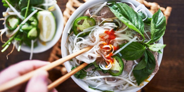 vietnamese pho with spicy sriracha sauce shot top down