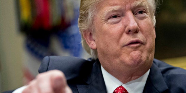 WASHINGTON, DC - FEBRUARY 7: (AFP OUT) U.S. President Donald Trump speaks as he meets with county sheriffs during a listening session in the Roosevelt Room of the White House on February 7, 2017 in Washington, DC. The Trump administration will return to court Tuesday to argue it has broad authority over national security and to demand reinstatement of a travel ban on seven Muslim-majority countries that stranded refugees and triggered protests. (Photo by Andrew Harrer - Pool/Getty Images)