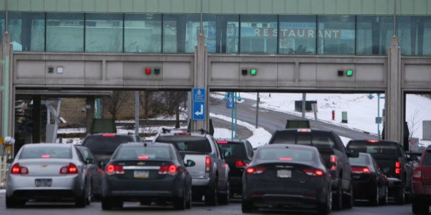 Vehicles make their way through the Canadian border crossing in Niagara Falls, Ontario, Canada, on Jan. 23, 2016. A 34 percent plunge in the Canadian dollar since 2011 is spurring a reversal of traffic along the longest undefended border in the world. Photographer: Cole Burston/Bloomberg via Getty Images
