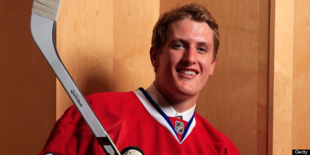 NEWARK, NJ - JUNE 30: Michael McCarron poses for a portrait after being selected number twenty five overall in the first round by the Montreal Canadiens during the 2013 NHL Draft at the Prudential Center on June 30, 2013 in Newark, New Jersey. (Photo by Jamie Squire/Getty Images)