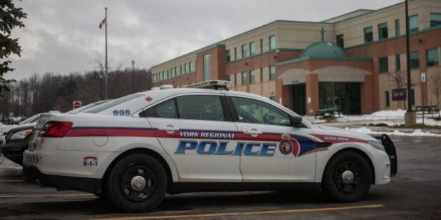 TORONTO, ON - DEC. 6: TORONTO, ON - DEC. 6: A York Regional Police cruiser sits outside Cardinal Carter Catholic High School. Four students from the school were told to stay home Tuesday after video surfaced online of them involved in a fight and a beating of a parent on Friday afternoon. (Jesse Winter/Toronto Star via Getty Images)