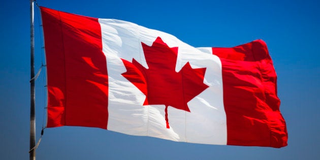 Maple leaf flag flying in the wind