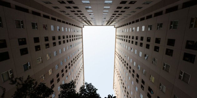 A residential apartment building stands in Jakarta, Indonesia, on Tuesday, June 23, 2015. Having watched his economic reform momentum falter in recent months, Indonesian President Joko Widodo is resurrecting his biggest policy success by cutting more subsidies. Photographer: Dimas Ardian/Bloomberg via Getty Images