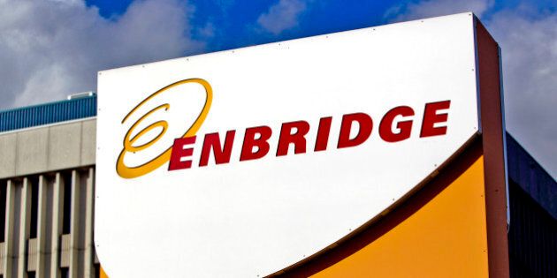 Enbridge Inc. signage is displayed outside of the company's corporate office in Toronto, Ontario, Canada, on Friday, Oct. 28, 2011. Enbridge Inc. provides energy transportation, distribution, operates crude oil and liquids pipeline systems, natural gas transmission for midstream businesses in North America and internationally. Photographer: Brent Lewin/Bloomberg via Getty Images