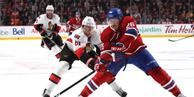 Nov 22, 2016; Montreal, Quebec, CAN; Montreal Canadiens defenseman Jeff Petry (26) plays the puck against Ottawa Senators right wing Mark Stone (61) during the third period at Bell Centre. Mandatory Credit: Jean-YvesAhern-USA TODAY Sports