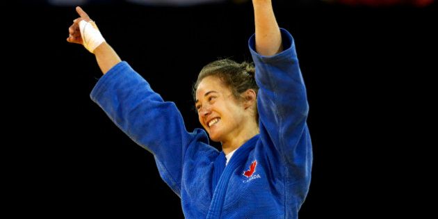 Canada's Stefanie Tremblay celebrates after beating Brazil's Mariana Silva during a women's -63kg judo match at the Pan Am Games, Monday, July 13, 2015, in Mississauga, Ontario. (AP Photo/Julio Cortez)