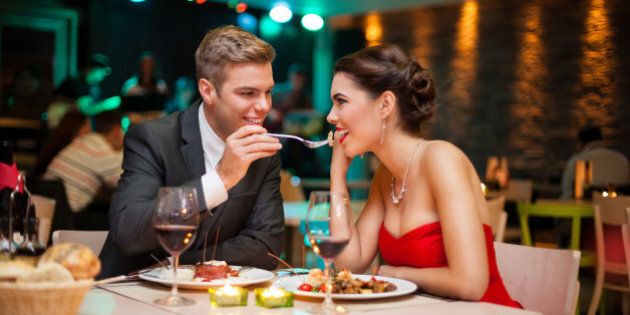 Lovely young couple eating on romantic dinner