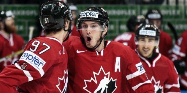 Canadaâs Matt Duchene, center, reacts as Connor McDavid, left, scored the first goal during the Ice Hockey World Championships final match between Finland and Canada, in Moscow, Russia, on Sunday, May 22, 2016. (AP Photo/Pavel Golovkin)
