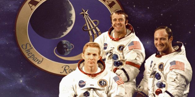 The prime crew of the Apollo 14 lunar landing mission on Dec. 3, 1970. L to R: Command Module pilot, Stuart A. Roosa; Commander, Alan B. Shepard, Jr.; and Lunar Module pilot, Edgar D. Mitchell. The Apollo 14 mission emblem is in the background.