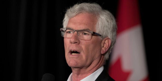 Jim Carr, Minister of Natural Resources, speaks to the media while his cabinet and he take part in a two-day Liberal retreat in Calgary, Alberta, Canada on January 24, 2017. REUTERS/Chris Bolin