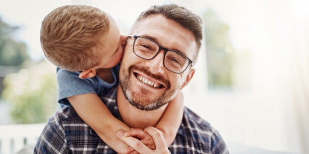 Cropped portrait of a father bonding with his son at home