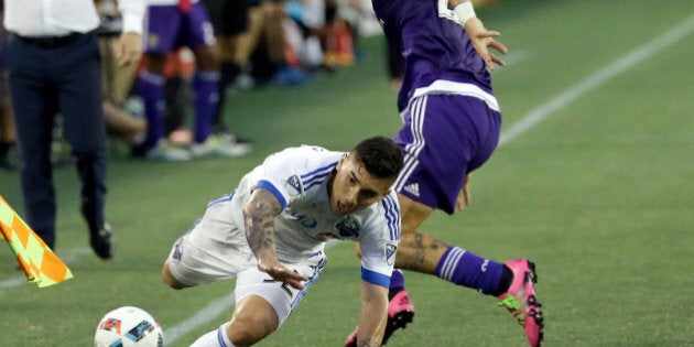 Montreal Impact's Lucas Ontivero, left, and Orlando City's Brek Shea collide while going for the ball during the first half of an MLS soccer game, Saturday, May 21, 2016, in Orlando, Fla. (AP Photo/John Raoux)