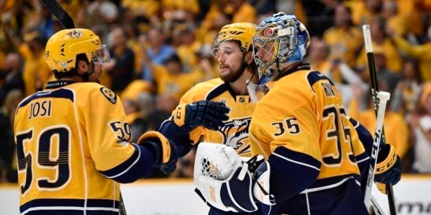 Jun 3, 2017; Nashville, TN, USA; Nashville Predators goalie Pekka Rinne (35) celebrates with teammates including defenseman Roman Josi (59) after defeating the Pittsburgh Penguins in game three of the 2017 Stanley Cup Final at Bridgestone Arena. Mandatory Credit: Christopher Hanewinckel-USA TODAY Sports