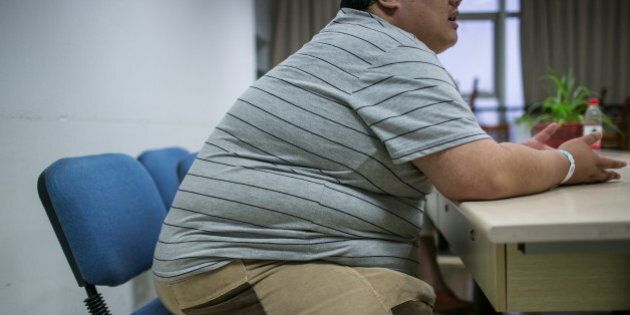 HANGZHOU, CHINA - SEPTEMBER 02: (CHINA OUT) A 200 kg man decides to do weight loss surgery on September 2, 2014 in Hangzhou, China. A 180-cm-tall 200-kg-weigh man with a waistline of over 155 cm has decided to do weight loss surgery due to a fat colleague died of obstructive sleep apnea syndrome caused by obesity. (Photo by ChinaFotoPress/ChinaFotoPress via Getty Images)