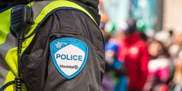 Montreal, Canada - 19 March 2017: Close-up of a police patch with crowd n the background at St. Patrick's Day parade