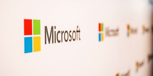 The logo of Microsoft Corp. is displayed at the company's Office and Experience Center in Hong Kong, China, on Friday, March 4, 2016. Microsoft is rolling out a new service for its Windows 10 operating system to help large businesses detect hackers, security threats and unusual behavior on their networks, rivaling companies like FireEye Inc. and Symantec Corp. Photographer: Billy H.C. Kwok/Bloomberg via Getty Images