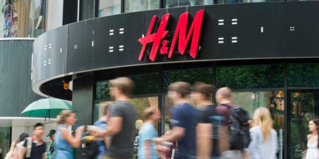 Frankfurt, Germany - August 14: People pass by a branch of H+M ( H&M, Hennes and Mauritz ) department store on August 14, 2015 in Frankfurt, Germany. (Photo by Michael Gottschalk/Photothek via Getty Images)
