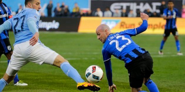 Montreal Impact's Laurent Ciman (23) defends New York City FC's RJ Allen (27) during the first half of an MLS soccer match Wednesday, April 27, 2016, at Yankee Stadium in New York. (AP Photo/Frank Franklin II)