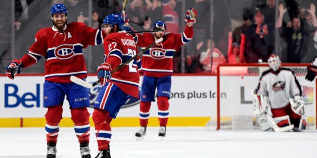 Feb 28, 2017; Montreal, Quebec, CAN; Montreal Canadiens forward Alex Galchenyuk (27) reacts with teammate Shea Weber (6) after scoring a goal against Columbus Blue Jackets goalie Sergei Bobrovsky (72) during the overtime period at the Bell Centre. Mandatory Credit: Eric Bolte-USA TODAY Sports