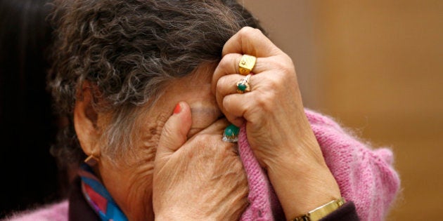 Kang Il-chul, a South Korean woman abused by Japan's wartime military-run brothel system, cries during a press conference in Tokyo, Tuesday, Jan. 26, 2016. Two elderly South Korean women, Kang and Lee Ok-sun, are in Japan to reject a recent settlement agreement between the two governments and demand that Prime Minister Shinzo Abe give them a face-to-face apology and formal compensation. (AP Photo/Shizuo Kambayashi)